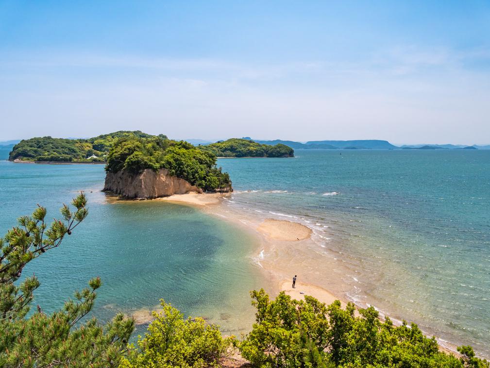 Angel road is a popular tourist spot where roads appear and disappear with tides full of tides on Shodoshima, Kagawa Prefecture, Japan.